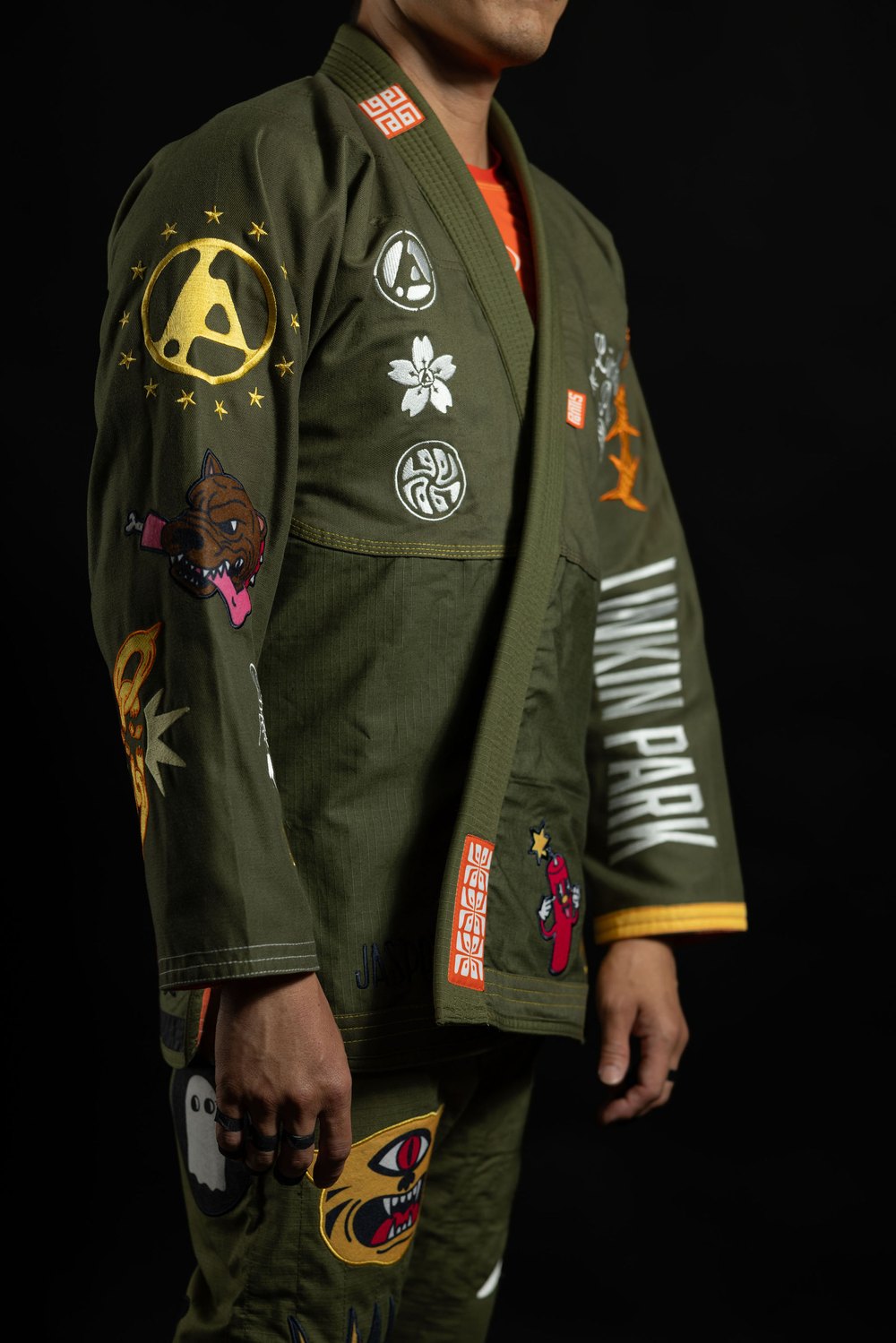 Linkin Park x Jasper Wong reversible jiu jitsu kimono worn three-quarter, military green with hand-placed patches and embroidery