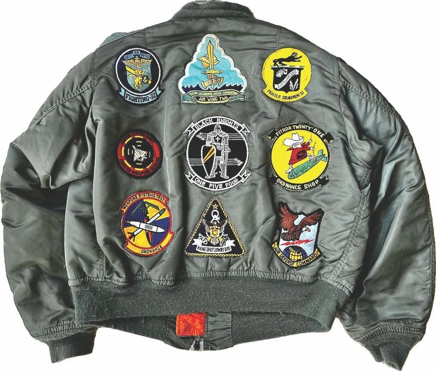 MA-1 bomber jacket back covered in squadron patches
