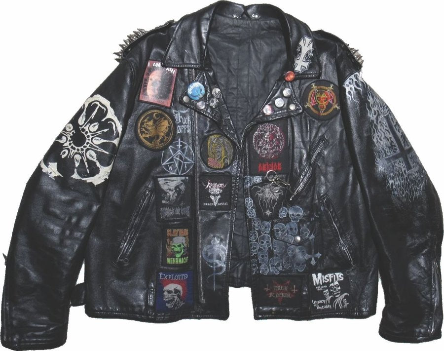 Punk battle jacket layered with patches and pins