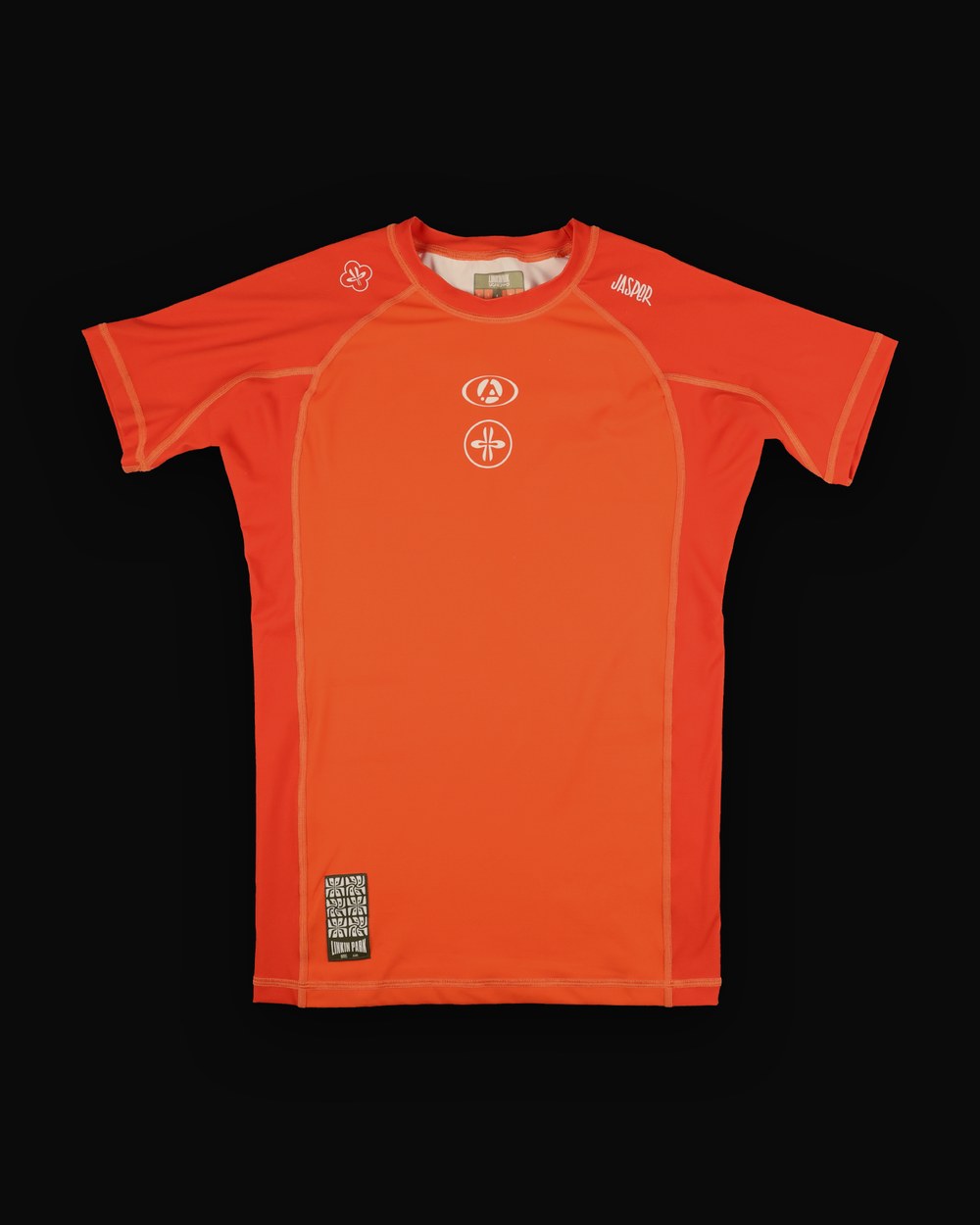 No-gi rashguard, orange colorway, studio flat-lay, front