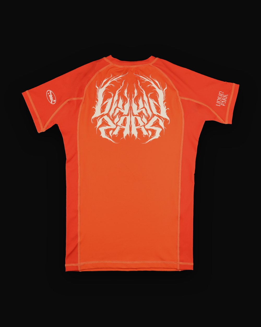 No-gi rashguard, orange colorway, studio flat-lay, Linkin Park metal-script back print